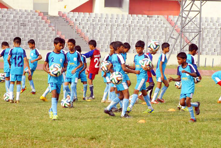 Members of Bangladesh Under-12 Football team during their practice session at the Bangabandhu National Stadium on Saturday. Bangladesh U-12 Football team to play Super Mokh Cup 2014, which will begin from December 5, 2014 in Malaysia.