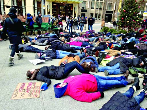 About 200 people demonstrate at a plaza near the historic water tower, located along Chicago's Michigan Avenue, on Friday. Internet photo