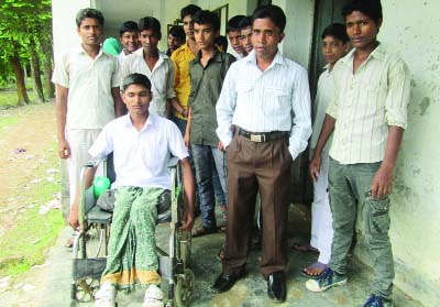 PIROJPUR: Prince Edbor, 15, a student of class nine in Commerce Group of Mirukhali High School of Mathbaria Upazila in Pirojpur going to school by wheel chair .