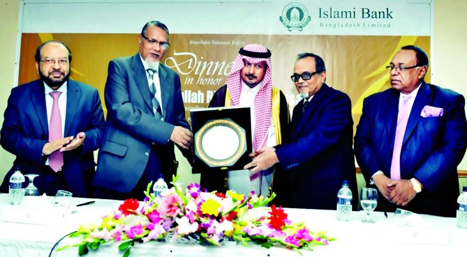 Prof Abu Nasser Muhammad Abduz Zaher and Engr Mustafa Anwar, Chairman and Vice Chairman of Islami Bank Bangladesh Limited, handing over a crest to outgoing Saudi Ambassador Dr Abdullah Bin Naser Al Busairi at a city hotel on Saturday.