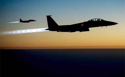 AP file photo shows a pair of US F-15E Strike Eagles fly over northern Iraq after conducting airstrikes in Syria.