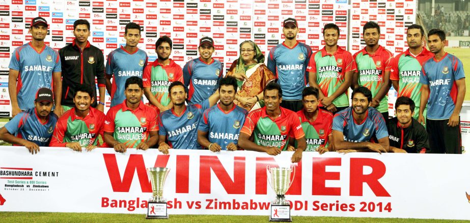 Players of Bangladesh Cricket team pose with the series trophies and Prime Minister Sheikh Hasina after winning the fifth and the final ODI match against Zimbabwe at the Sher-e Bangla National Cricket Stadium in Mirpur on Monday.