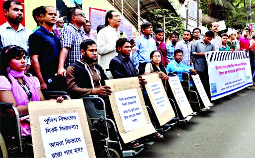 Physically challenged persons among others formed human chain jointly organized by different civil society organisations on Tuesday in front of Jatiya Press Club demanding Zebra crossing on city streets, so that they could safety cross the road.