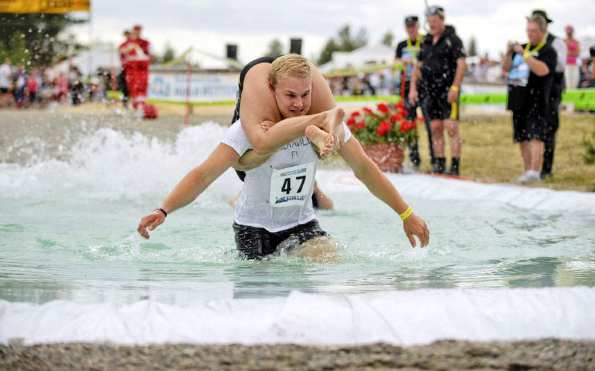 A Finnish couple : Ville Parviainen and Janette Oksman - won the 2014 World Wife Carrying World Championships held in Finland on Saturday.