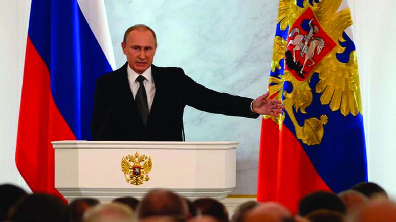 Russia's President Vladimir Putin addresses the Federal Assembly, including State Duma deputies, members of the Federation Council, the heads of the Constitutional and Supreme courts, regional governors, heads of Russia's traditional religious faiths an