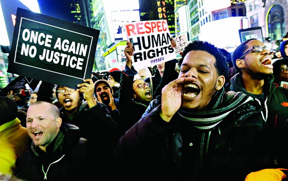 Protestors shout at Times Square after it was announced that the New York City police officer involved in the death of Eric Garner is not being indicted. Internet photo