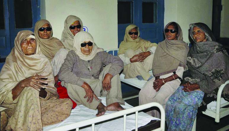 Indian elderly women who went blind following cataract surgeries performed at a free medical camp run by a charity sit together as they receive treatment at a hospital in Amritsar, India on Friday.