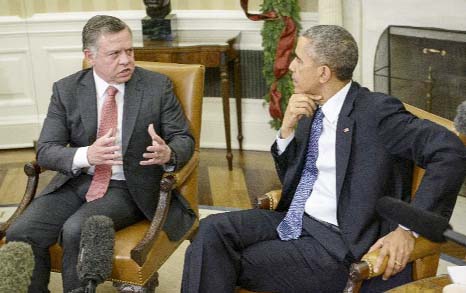 King Abdullah II of Jordan (L) talks to US President Barack Obama after their meeting in the Oval Office of the White House on Friday in Washington.