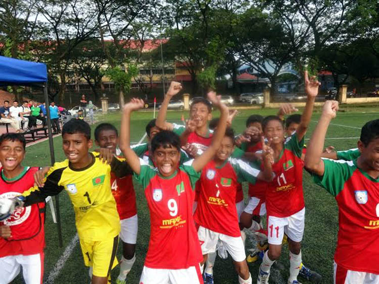 Players of Bangladesh Under-12 Football team celebrate after beating Saint Prima Academy team of Indonesia in the quarterfinal match of the Plate Group of the Super Mokh Cup in Malaysia on Saturday.