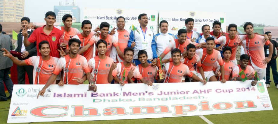 Members of Bangladesh Under-21 Hockey team, the champions of the Junior AHF Cup Hockey Qualifiers Tournament pose for a photo session at the Moulana Bhashani National Hockey Stadium on Sunday.