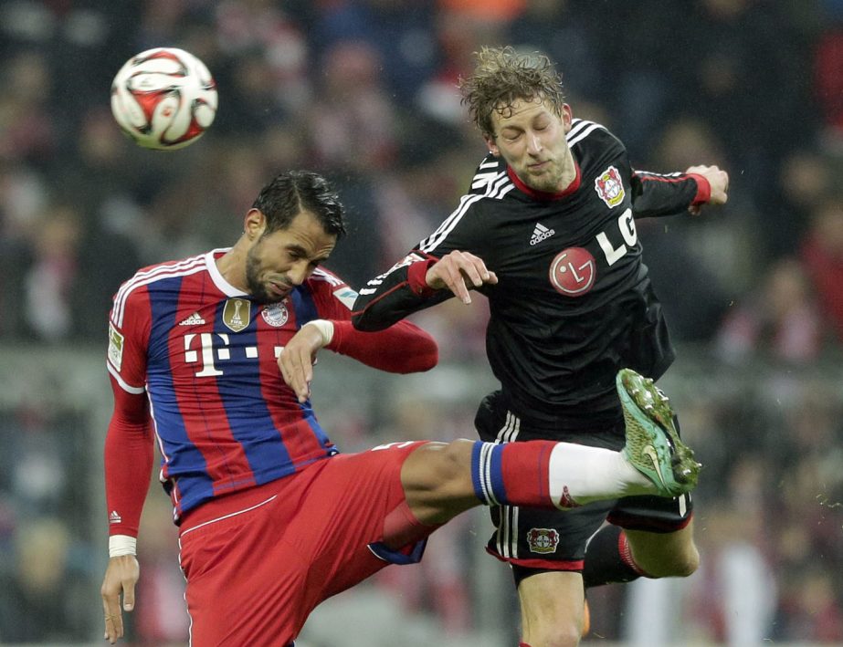 Bayernâ€™s Mehdi Benatia from Morocco, left, and Leverkusen's Stefan KieÃŸling challenge for the ball during the German first division Bundesliga soccer match between FC Bayern and Bayer Leverkusen 04 in the Allianz Arena in Munich, Germany, on Sa