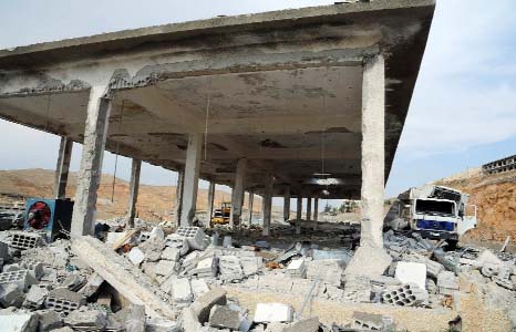 A general view of damaged buildings wrecked by an Israeli airstrike, in Damascus, Syria.