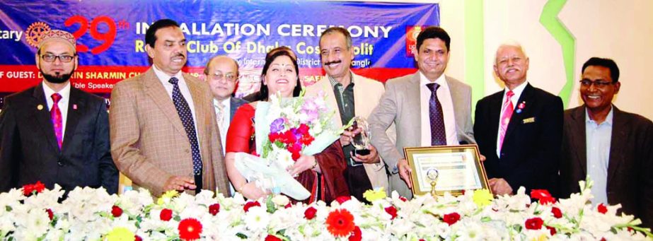 Rotary Governor Safina Rahman distributing Rotary awards to distinguished persons at an orientation ceremony at Rotary Club auditorium in the city on Sunday.