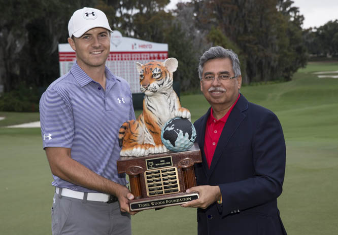 Jordan Spieth (left) and Pawan Munjal, vice chairman and managing director of Hero MotoCorp, hold the trophy after Spieth won the Hero World Challenge golf tournament in Windermere, Fla. on Sunday.