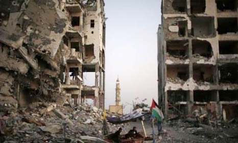 A Palestinian man reacts in front of the remains of a mosque, which witnesses said was destroyed in an Israeli air strike.