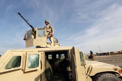 Iraqi soldiers undergo training at a shooting range in Arbil, in Iraq's northern autonomous Kurdistan region.