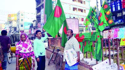 SYLHET: National flag sale increases in different points in Sylhet city ahead of Victory Day. This picture was taken from Bondorbazar point on Sunday.