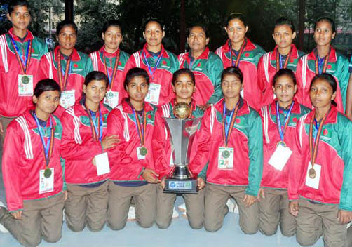 Members of Bangladesh National Women's Handball team, the champions of the IHF Trophy Tournament pose for a photo session at the Shaheed (Captain) M Mansur Ali National Handball Stadium on Tuesday. Banglar chokh