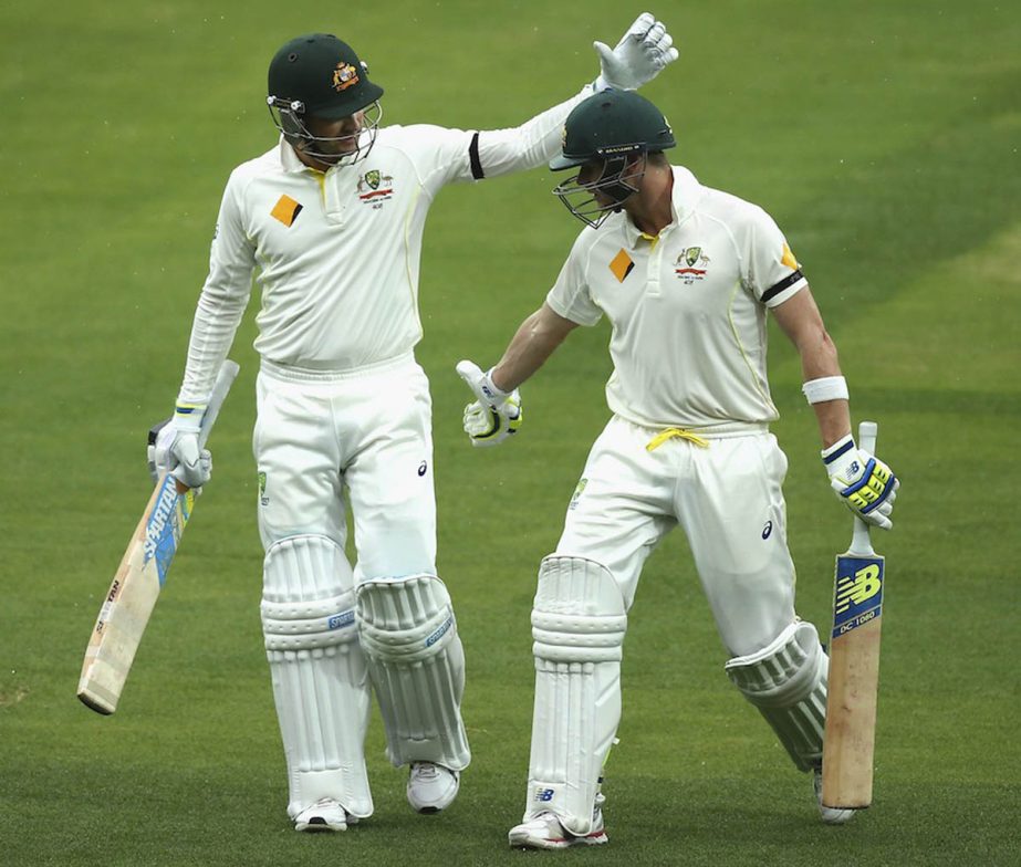 Steve Smith and Michael Clarke of Australia leave the ground during a rain delay day two of the first Test match between Australia and India at Adelaide Oval in Australia on Wednesday.