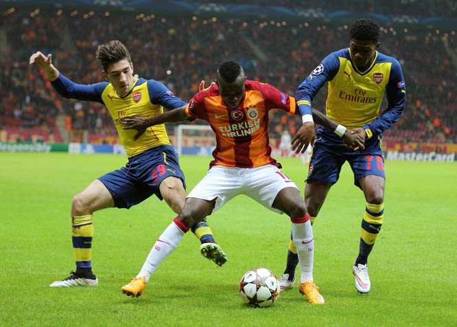 Arsenal's Hector Bellerin (left) and Ainsley Maitland-Niles (right) and Bruma of Galatasaray fight for the ball during their Champions League Group D soccer match at the Turk Telekom Arena Stadium in Istanbul, Turkey on Tuesday.