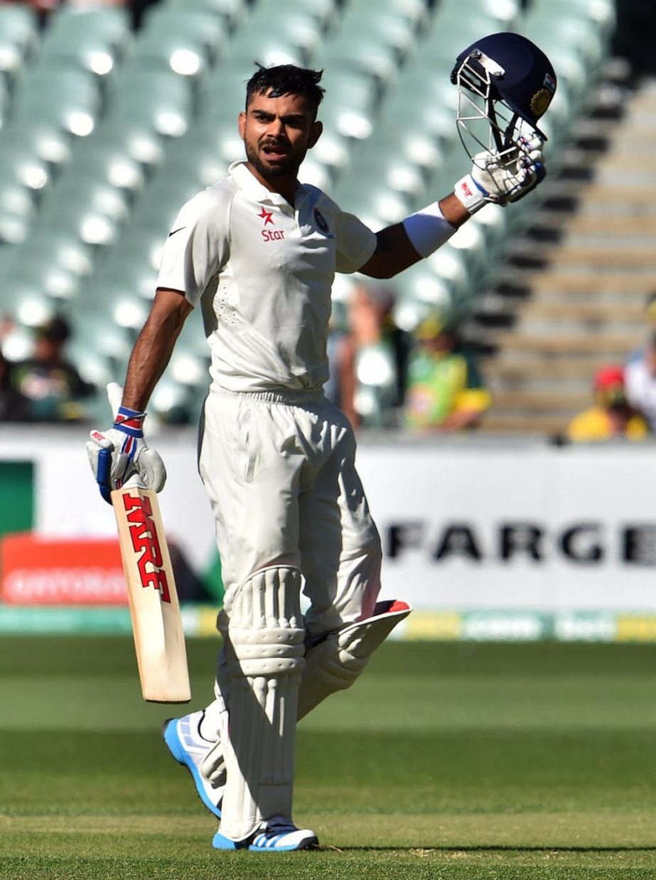 India's batsman Virat Kohli celebrates his century during the third day of the first Test cricket match between Australia and India at the Adelaide Oval on Thursday.