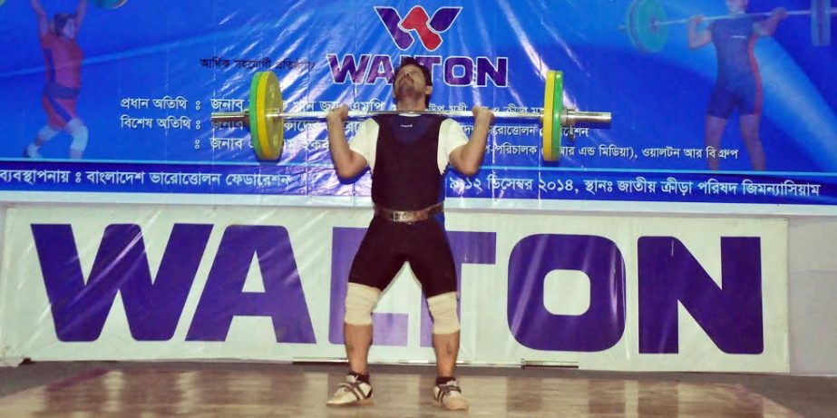 Biddyut Kumar Roy of Bangladesh Ansar lifting altogether (snatch 115 kg + jerk 125 kg) 240 kg in Men's Division of 105 kg weight category of the 34th National Senior Weightlifting Competition at the Gymnasium of National Sports Council on Thursday. Biddy