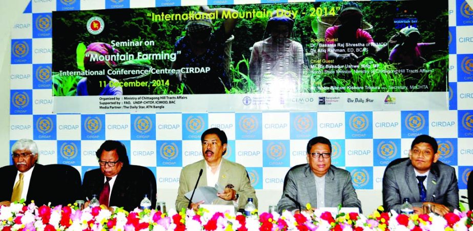State Minister for CHT Affairs Bir Bahadur Ushwe Sing speaking at a seminar organised on the occasion of International Mountain Day-2014 by CHT Affairs Ministry at CIRDAP Auditorium in the city on Thursday.