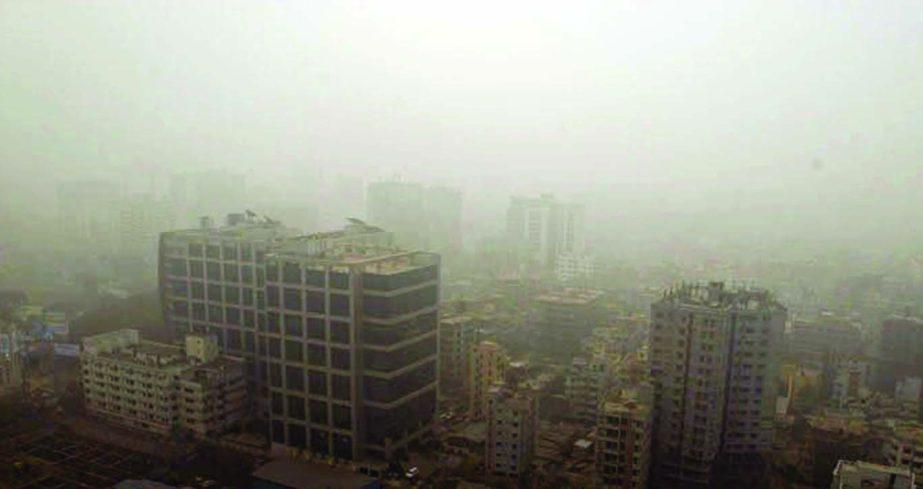 Dhaka city and its adjacent areas remained virtually blanketed by dense fog for the last two days. This snap was taken from Motijheel area on Thursday morning.