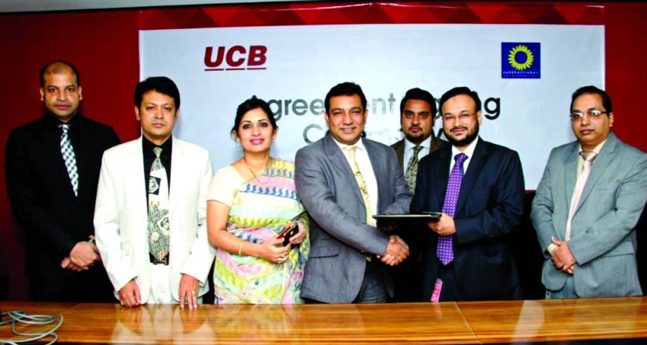 Sarder Akhter Hamed, Head of Retail Banking of United Commercial Bank Limited and Tauquir Ahmed, Managing Director of Nokkhottrobari Resort and Conference Center, sign a deal to provide 35percent discount to the bank's Credit Card holders and employees