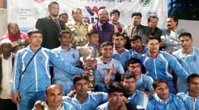 Players of Bangladesh Air Force pose for photo with the trophy of Walton Victory Day Kabaddi League at the Kabaddi Stadium on Monday.