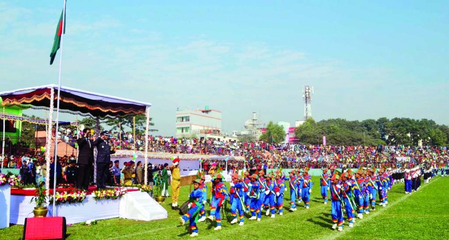 NARSINGDI: Abu Hena Morshad Jaman, DC, Narsingdi accompanied by Sheikh Rafiqul Islam, SP taking salute of a colourful combined parade at local Musleh Uddin Bhuiyan Stadium on the occasion of the Victory Day on Tuesday.