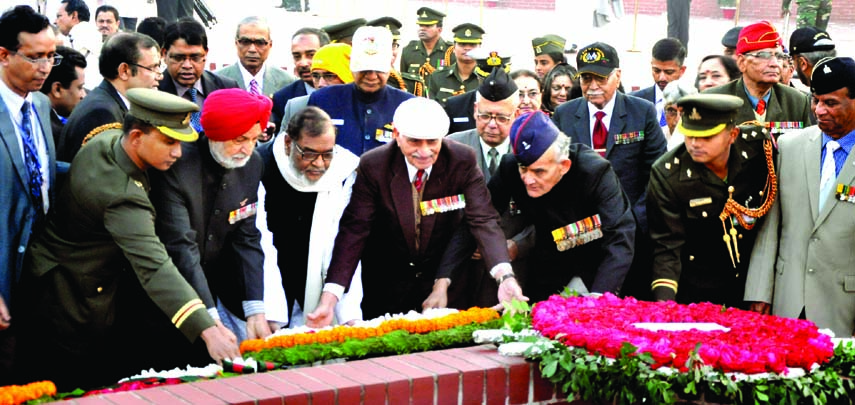 A delegation of retired Indian military officers who fought for Bangladesh Liberation War in 1971 paying tributes to martyred freedom fighters by placing floral wreaths at Savar National Memorial on Tuesday marking glorious Victory Day.