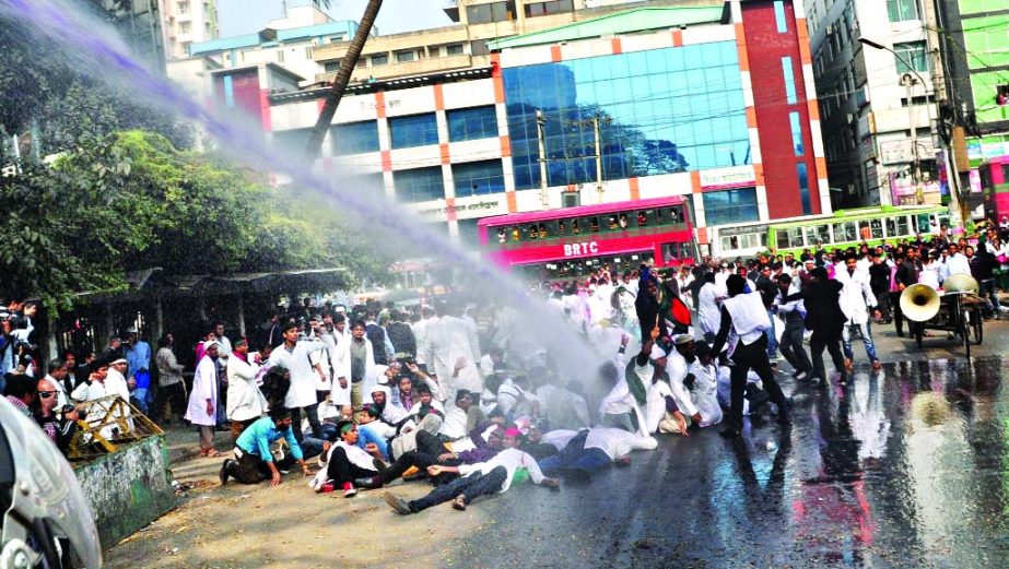 Police charge batons, use water cannon on the students of B Sc Dental College while they were going ahead to gherao Health Ministry from in front of Jatiya Press Club on Wednesday.