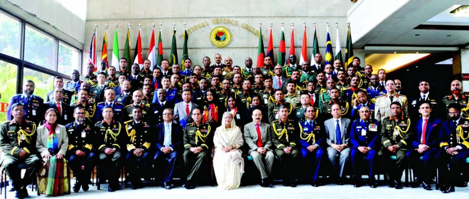 Prime Minister Sheikh Hasina along with the participants of the Graduation Ceremony of National Defense Course (NDC) and Armed Forces War (AFW) Course-2014 poses for photograph at NDC auditorium of Mirpur Cantonment in the city on Thursday. BSS photo