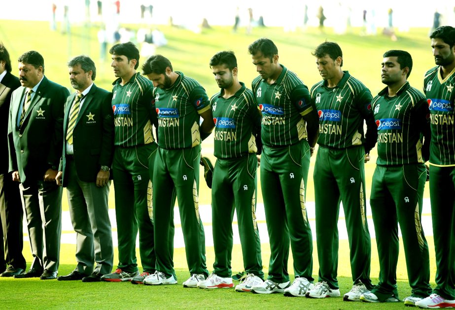 The Pakistan team observes two minutes of silence in memory of the victims of the Peshawar terror attack, during the 4th ODI between Pakistan and New Zealand in Abu Dhahi on Wednesday.