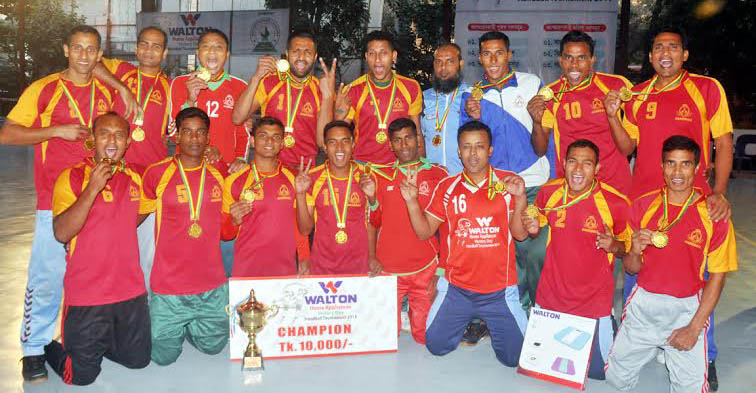 BGB, the champions of the Walton Home Appliance Victory Day Handball (Men's Division) Tournament pose for a photograph at the Shaheed (Captain) M Mansur Ali National Handball Stadium on Thursday.