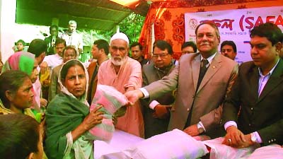 GAIBANDHA: Safal, a social development organisation distributing blankets among cold-hits at Khohati Union of Gaibandha Sadar Upazila yesterday.