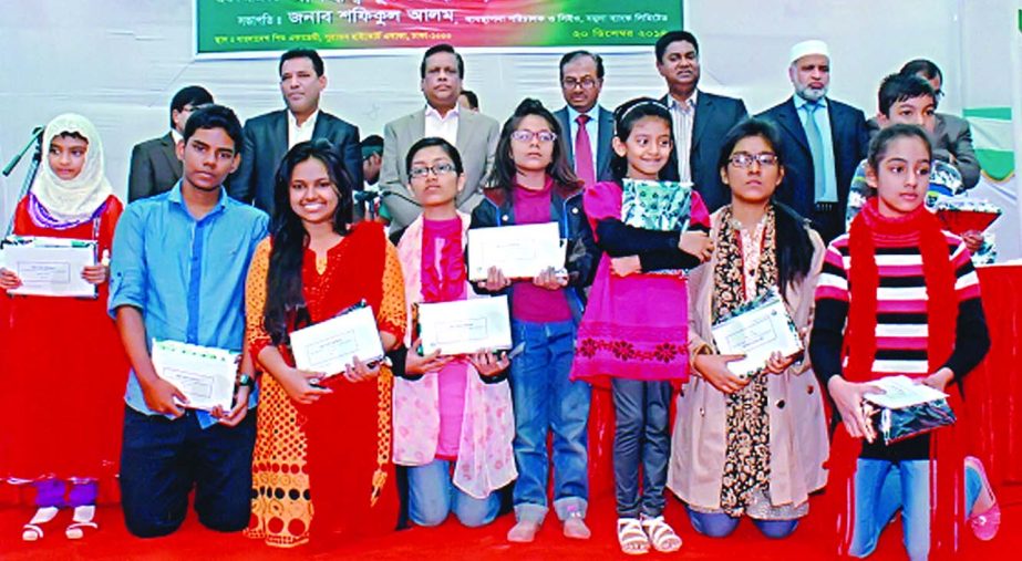Nur Mohammed, Chairman of Jamuna Bank Foundation poses with the participants of an art competition organized by Foundation at Bangladesh Shishu Academy premises on the occasion of Victory Day. Shafiqul Alam, Managing Director of Jamuna Bank presided.