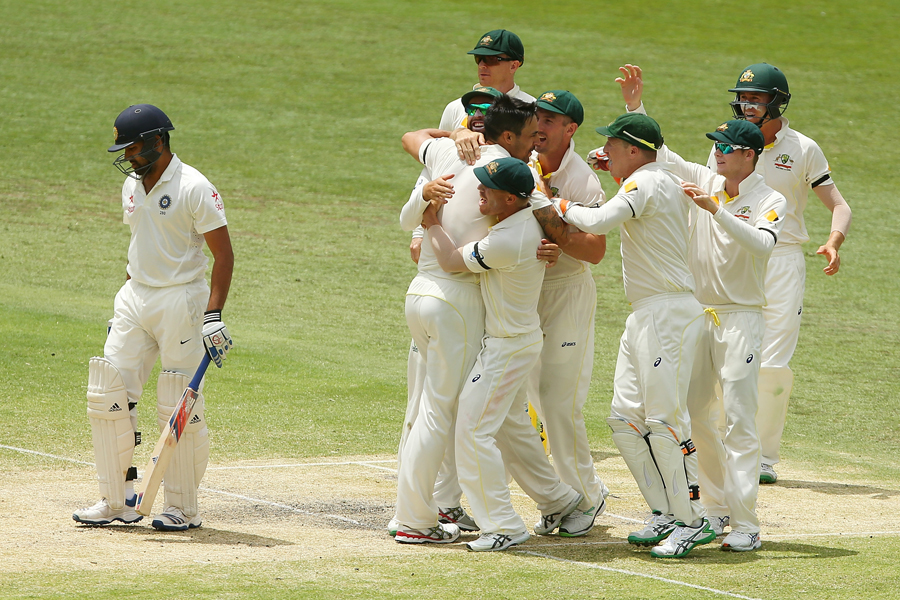 Australia celebrate Rohit Sharma's wicket on the 4th day of 2nd Test between Australia and India at Brisbane on Saturday.