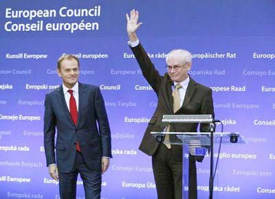 Former Polish Prime Minister Donald Tusk (L) and outgoing European Council President Herman Van Rompuy attend a ceremony, during which Tusk took over from Van Rompuy and officially replaced him as head of the European Council, in Brussels