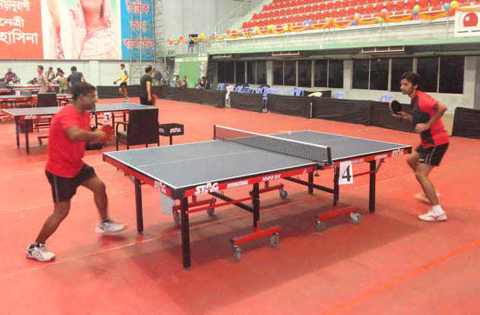 A scene from the Dhaka Metropolis First Division Table Tennis League between Boys Club and Combined Sporting Club at the Shaheed Tajuddin Ahmed Indoor Stadium on Sunday.