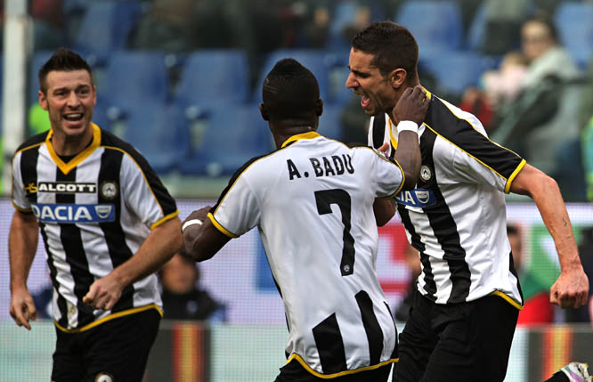 Udinese forward Alexandre Geijo (right) celebrates with his teammates Giovanni Pasquale (left) and Emmanuel Badu, back to the camera, after scoring during a Serie A soccer match between Sampdoria and Udinese in Genoa, Italy on Sunday. Sampdoria was held t