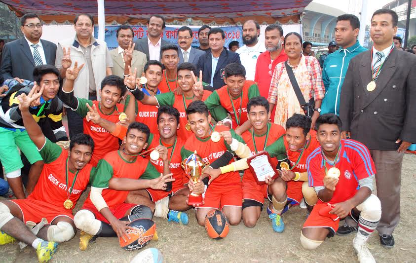 Players of Adamji Cantonment College pose for photo with the championship trophy of Quick City College Rugby Tournament at the Paltan ground on Monday.