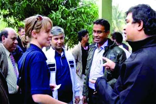 The members of the UN team for assessing damage following capsize of oil tanker, talking to some forest officers on their arrival at Mongla on way to Sundarbans on Monday.