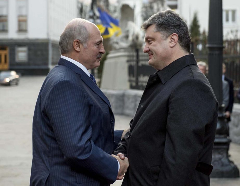 Ukrainian President Petro Poroshenko, (right), welcomes Belarussian President Alexander Lukashenko during their meeting in Kiev, Ukraine on Monday.