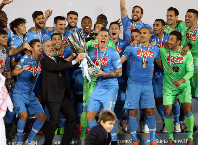 Napoli Chairman Aurelio De Laurentiis, centre left, holds with Napoli's Slovak midfielder and captain Marek Hamsik (centre) the Italian Super Cup trophy following their football match against Series A champions Juventus FC at the Sheikh Jassim Bin Hamad