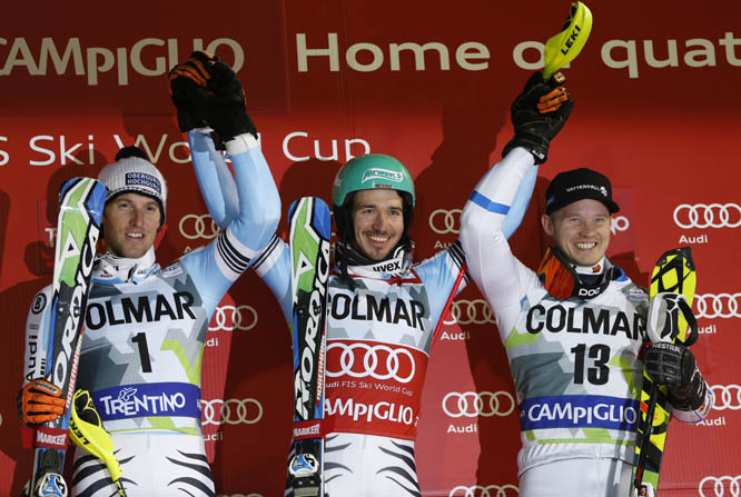 Felix Neureuther, of Germany (center) winner of an alpine ski, men's World Cup slalom race, celebrates on the podium with second placed Germany's Fritz Dopfer (left) and third placed Jens Byggmark of Sweden in Madonna di Campiglio, Italy on Monday. Feli