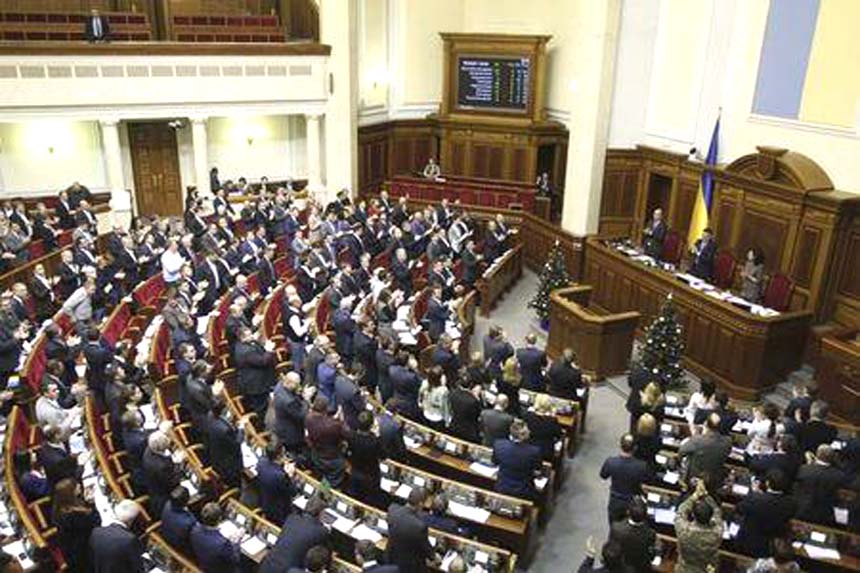 Parliamentary deputies applaud after a renouncing of Ukraine's "non-aligned"" status during a session of a parliament in Kiev on Tuesday."