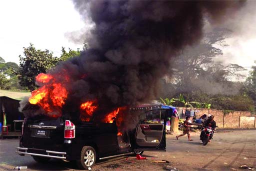 Angry BNP activists in retaliation torched the car of AL Netrakona-1 MP Chhoby Biswas near DMCH Energency Deptt following attacks on them by BCL activists on Wednesday.