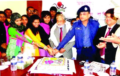 NETRAKONA: Prominent social worker and physician Dr M A Hamid with Netrakona SP Jakir Hussain Khan cutting cake to celebrate the 62nd founding anniversary of the Daily Ittefaq on Wednesday.